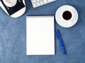 Top view of dark blue desktop with microscope, notepad, computer. Mock up, empty space, science template