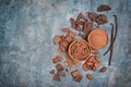Top view of dark chocolate chunks and chips with cocoa beans, powder and vanilla sticks Royalty Free Stock Photo