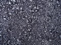 Top view dark grey fresh new asphalt road texture with small rocks Royalty Free Stock Photo