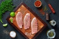 Wooden cutting board with three pieces of pork schnitzel Royalty Free Stock Photo