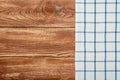 Top view on a dark wooden table with a linen kitchen towel or textile napkin. a tablecloth on a countertop made of old wood Royalty Free Stock Photo