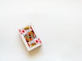 Top view of a deck of playing cards with a king with a diamond suit on top isolated on a white background. The concept of games,