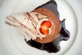 Top view of a decorated tiramisu cake with strawberries.