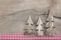 Top view of decoration with three pine tree on wooden background