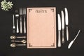 top view of decorative blank menu and cutlery