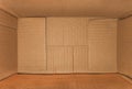 Top view of deep empty cardboard box, opened brown paper carton box, empty cardboard box close up, inside view Royalty Free Stock Photo