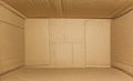 Top view of deep empty cardboard box, opened brown paper carton box, empty cardboard box close up, inside view Royalty Free Stock Photo