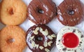 Top view of delectable six doughnuts in various flavors