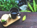 Top view Delicious Breakfast with Fresh sandwich and Black coffee cup on the wooden table Royalty Free Stock Photo