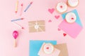 Top view of delicious cupcakes, colorful candles and hearts symbols on pink Royalty Free Stock Photo