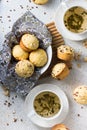 Top view of delicious cupcakes with nuts and two cups of green tea on the table Royalty Free Stock Photo