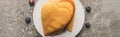 Top view of delicious heart shaped pancakes on plate near blueberries on grey concrete surface, panoramic shot Royalty Free Stock Photo