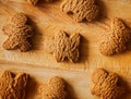 Top view of delicious homemade oatmeal cookies in the form of gingerbread men lying on a wooden kitchen board. Sweet breakfast Royalty Free Stock Photo
