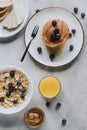 top view of delicious homemade pancakes glass of juice honey and muesli Royalty Free Stock Photo