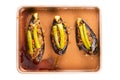 Top view of delicious homemade turkey stuffed eggplants or Karniyarik in tray metal oven