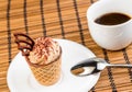 Top of view of delicious little coffee cake with chocolate near a cup of coffee