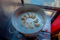 Top view of delicious momo food over a metallic tray in the kitchen, type of South Asian dumpling native to Tibet, Nepal