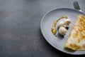 Tasty breakfast,omelet and fresh mushooms on plate,black background