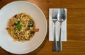 Delicious spicy spaghetti with bacon, dried chilli, basil and garlic with fork and spoon prepare side dish Royalty Free Stock Photo