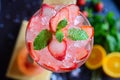 Top view of a delicious strawberry gin and tonic garnished with mint