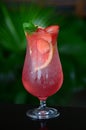 Top view of a delicious strawberry gin and tonic garnished with mint