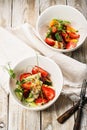 Top view delicious summer salad. Salad with fresh strawberries, baked beets, yellow tomatoes, dor blue cheese and herbs in a white Royalty Free Stock Photo