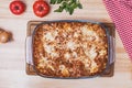 Top view of a delicious traditional italian lasagna made with minced beef bolognese sauce on wooden table Royalty Free Stock Photo