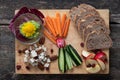 Top view of delicious vegan appetizer served on wooden board