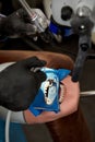 Top view of dentist hands who is learning to treat teeth on human head mannequin. Hands of medical student in black Royalty Free Stock Photo