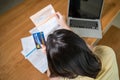 Top view of Depressed desperate Asian girl feel worry about financial problem in house. Stressed young woman look frustrated to Royalty Free Stock Photo