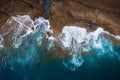 Top view of a deserted coast. Rocky shore of the island of Tenerife. Aerial drone photo of ocean waves reaching shore Royalty Free Stock Photo