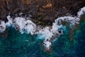 Top view of a deserted coast. Rocky shore of the island of Tenerife. Aerial drone photo of ocean waves reaching shore Royalty Free Stock Photo