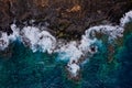 Top view of a deserted coast. Rocky shore of the island of Tenerife. Aerial drone photo of ocean waves reaching shore