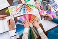 Top view of designer`s workspace, discussing colour sampler Royalty Free Stock Photo