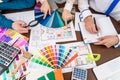 Top view of designer`s workspace, discussing colour sampler Royalty Free Stock Photo