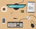 Top view of a desk background. There is a computer, smart phone, gray folder, stationery and cup of coffee