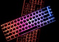 Top view of two illuminated RGB keyboards in the dark Royalty Free Stock Photo