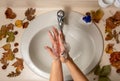 Woman detail cleaning her hands with water and soap