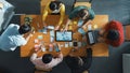 Top view of developer team working together to stick idea on board. Convocation.