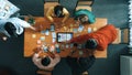 Top view of developer team working together to stick idea on board. Convocation.