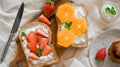 Top view, Diet breakfast, Toast with fresh slide orange and strawberry