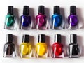 top view of different color vertical nail polish with solid white background Royalty Free Stock Photo