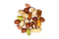 Top view of different nuts mix: almonds, pistachios, peanuts, hazelnuts heap isolated on white background.