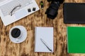 Top view at digital camera, laptop and notepad Royalty Free Stock Photo