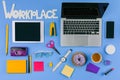 top view of digital devices, inscription workplace and office supplies with doughnut and coffee Royalty Free Stock Photo