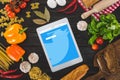 top view of digital tablet with twitter website and fresh ingredients