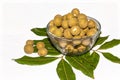 Top view of Dimocarpus longan.A bunch of Longan fruits with green leaves on white isolated background Royalty Free Stock Photo