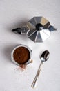 Top view of a disassembled geyser coffee maker with ground coffee Royalty Free Stock Photo