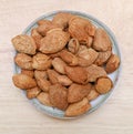 top view a dish of almond nuts