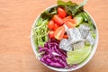 Top view of dish of Salad on wooden background